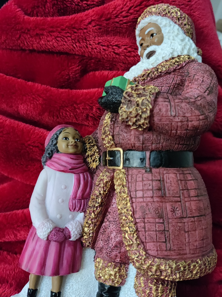 African American Santa figurine and child